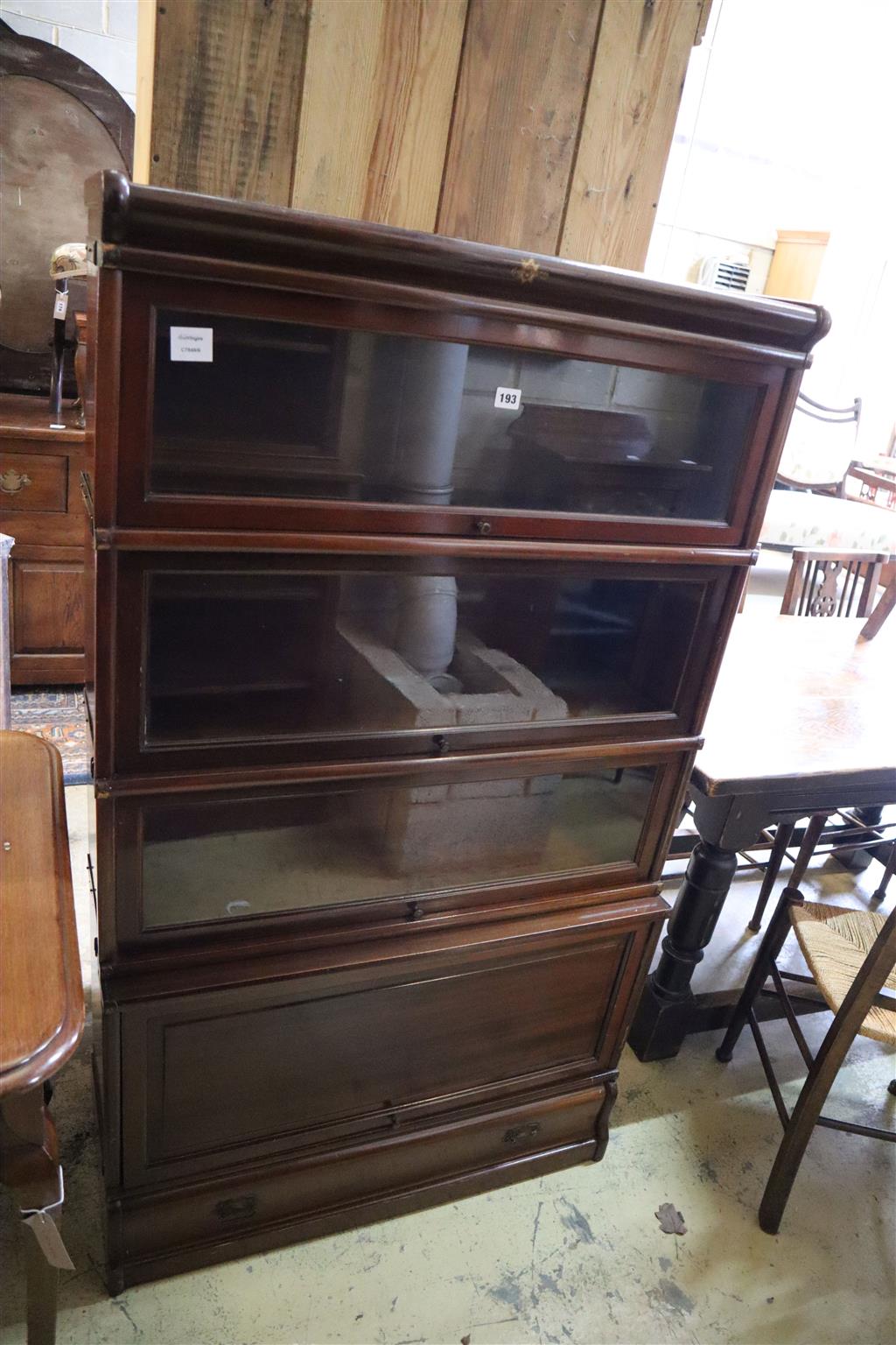 An early 20th century mahogany Kenrick Jefferson four section bookcase, width 86cm, depth 32cm, height 147cm